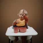 Mushie śliniak silikonowy Dinosaurs