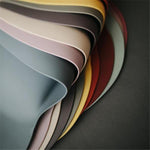 Mushie śliniak silikonowy Dinosaurs