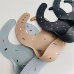 Mushie śliniak silikonowy Dinosaurs