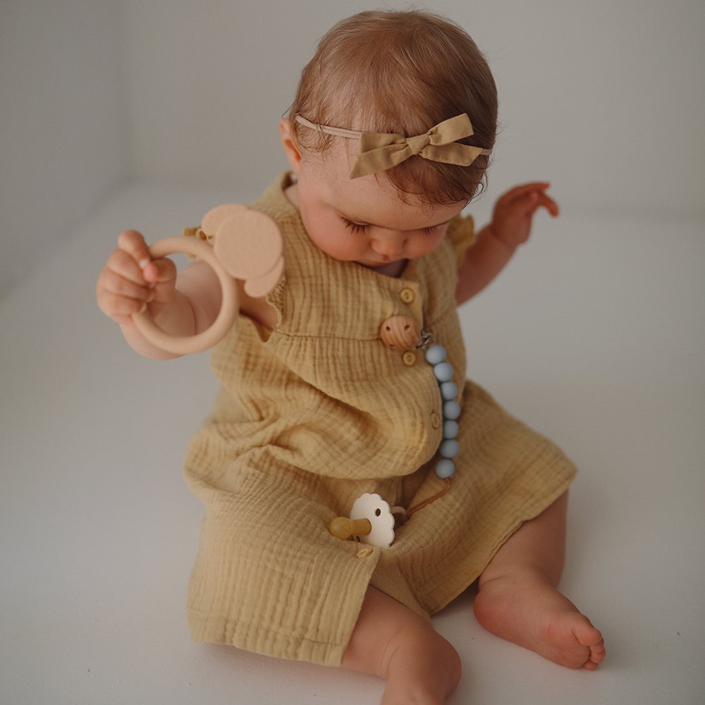 Mushie Silikonowy gryzak dla dziecka Teether Dog