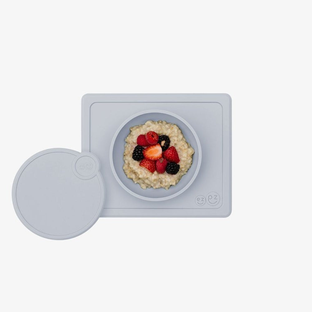 EZPZ Silikonowa miseczka dla niemowlaka Mini Bowl  z podkładką + pokrywka pastelowa szarość