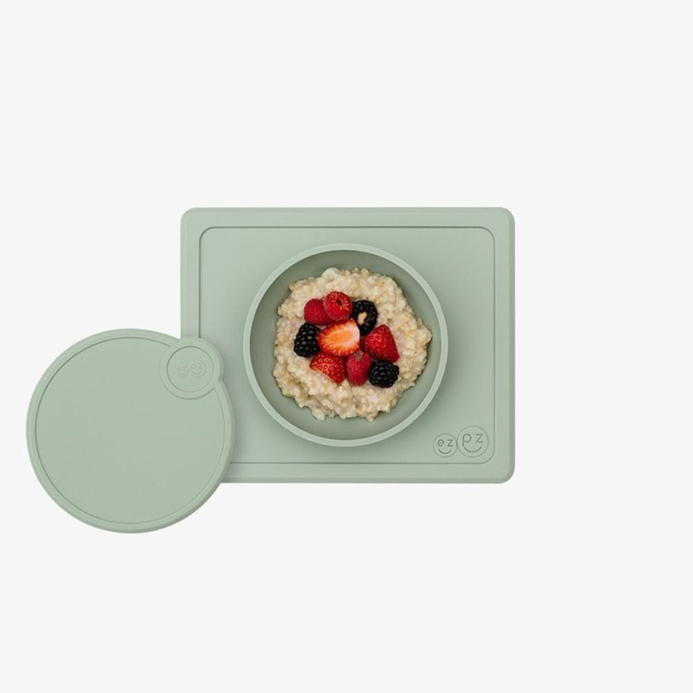 EZPZ Silikonowa miseczka dla niemowlaka Mini Bowl  z podkładką + pokrywka pastelowa zieleń