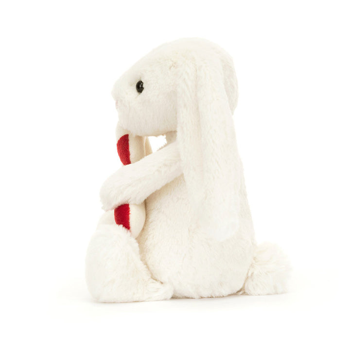 Jellycat maskotka wesoły króliczek z cukierkową laską 18 cm