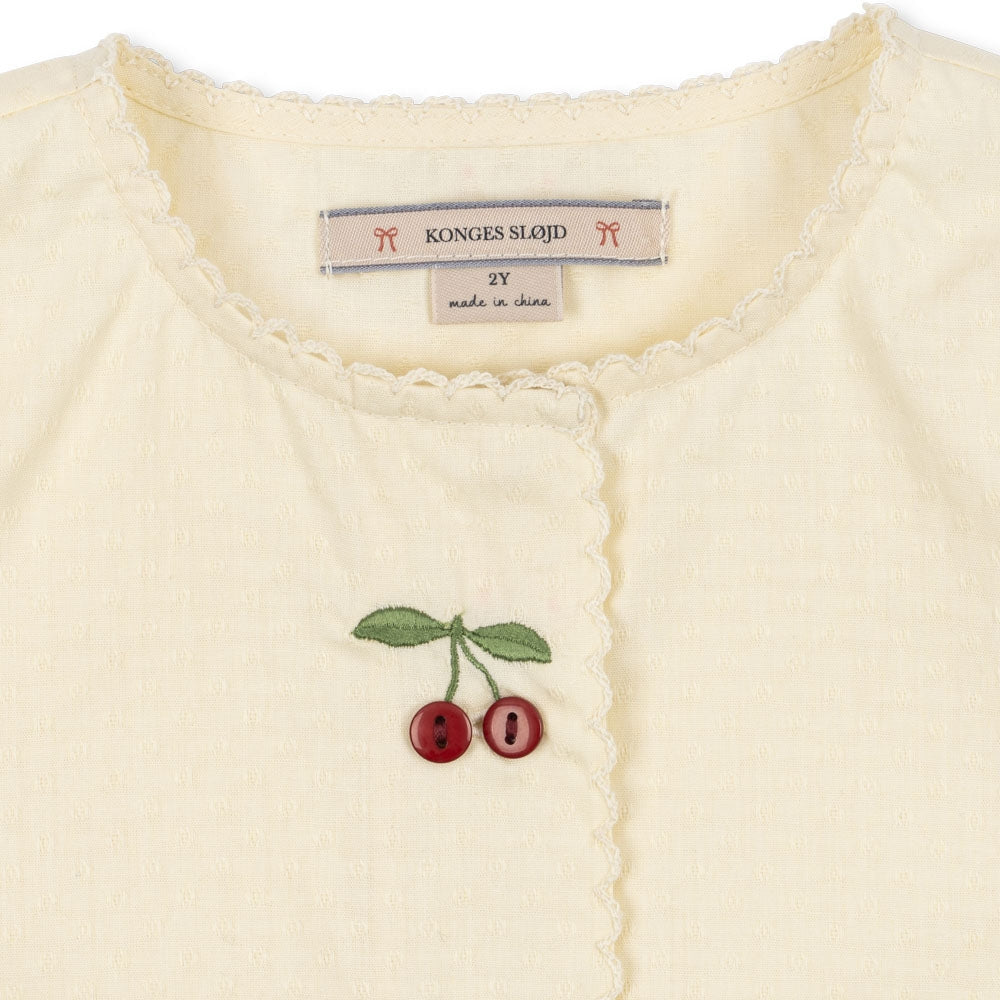 Konges Slojd Sukienka dla dziewczynki letnia Evia Cherry Cloud Cream