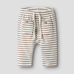 Lil’ Atelier Spodnie niemowlęce dla chłopca Coconut Milk NBMTONTO