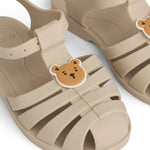 Liewood Sandały dziecięce z przypinkami Bre Bear / sandy