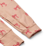 Liewood Piżama dla dziecka jednoczęściowa Birk Grow Printed Bows / Pale tuscany