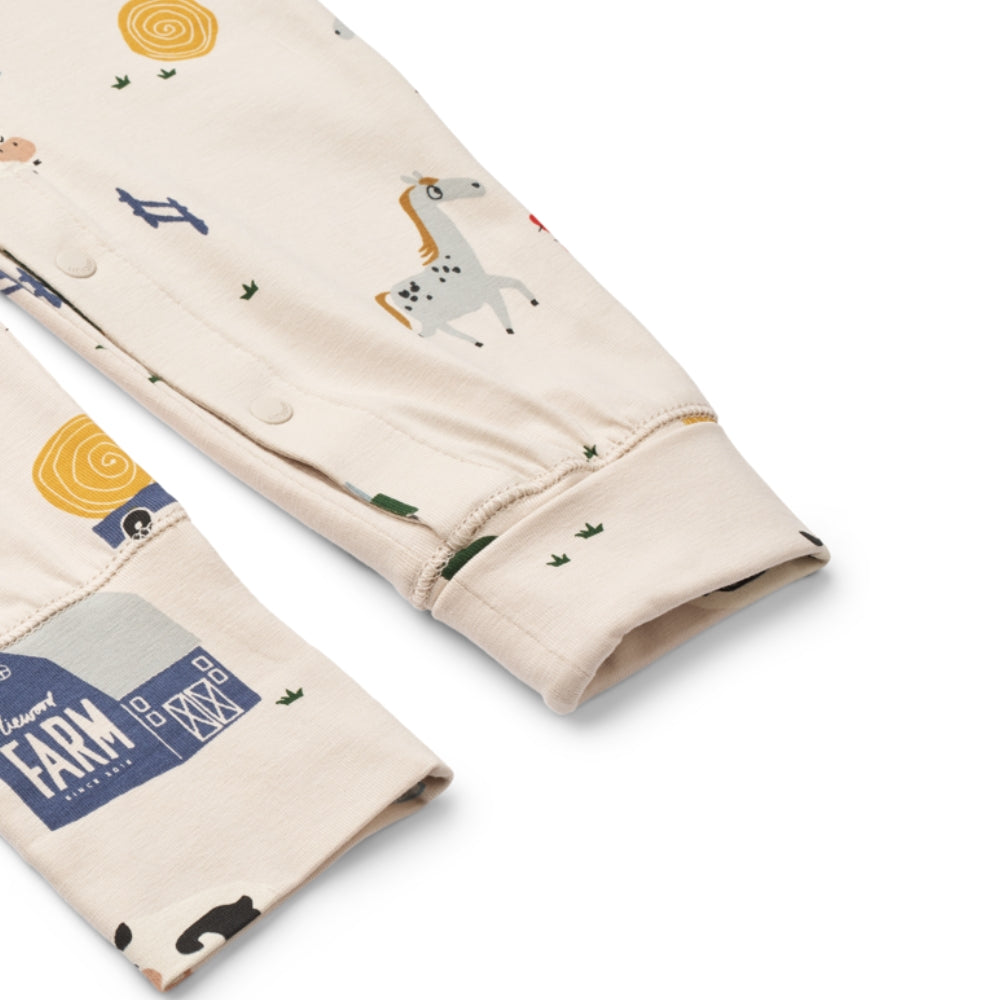 Liewood Piżama dla dziecka jednoczęściowa Birk Grow Printed Farmlife / Sandy