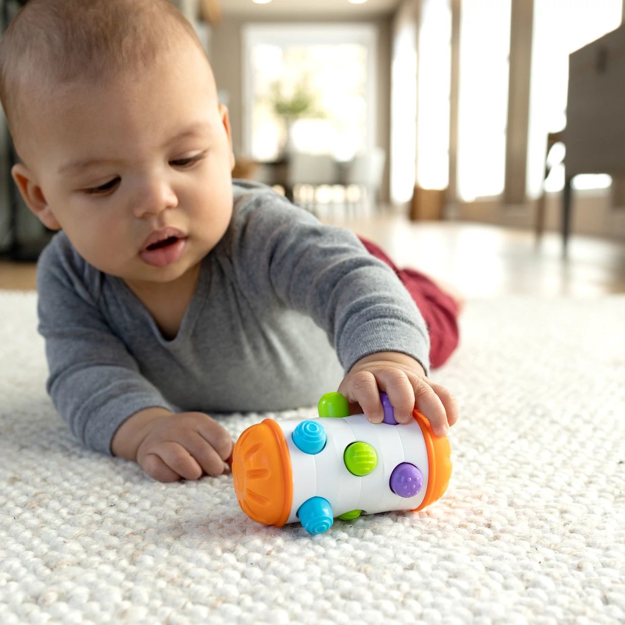 Fat Brain Toys Zabawka sensoryczna dla niemowląt Rolio Bobo Roller