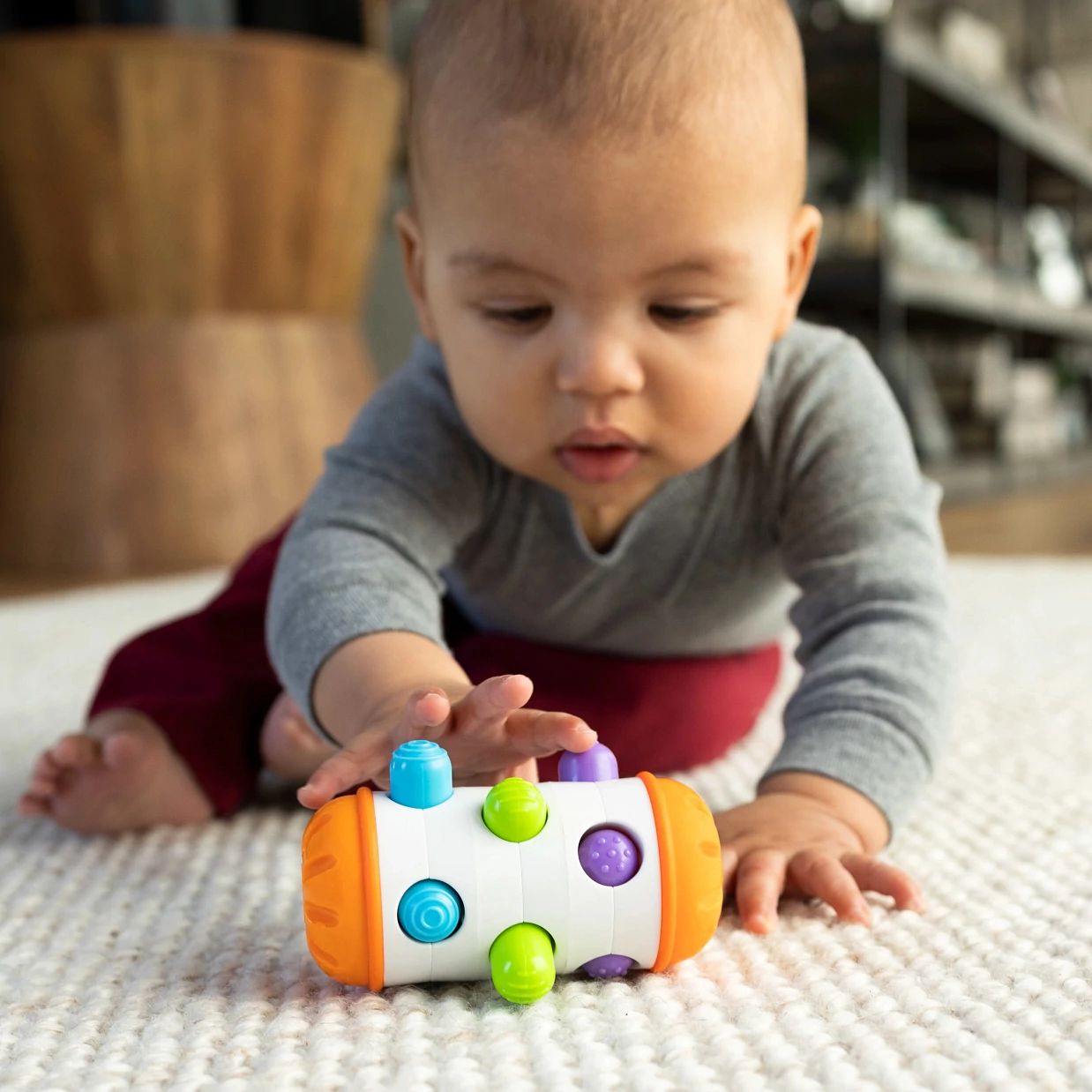 Fat Brain Toys Zabawka sensoryczna dla niemowląt Rolio Bobo Roller