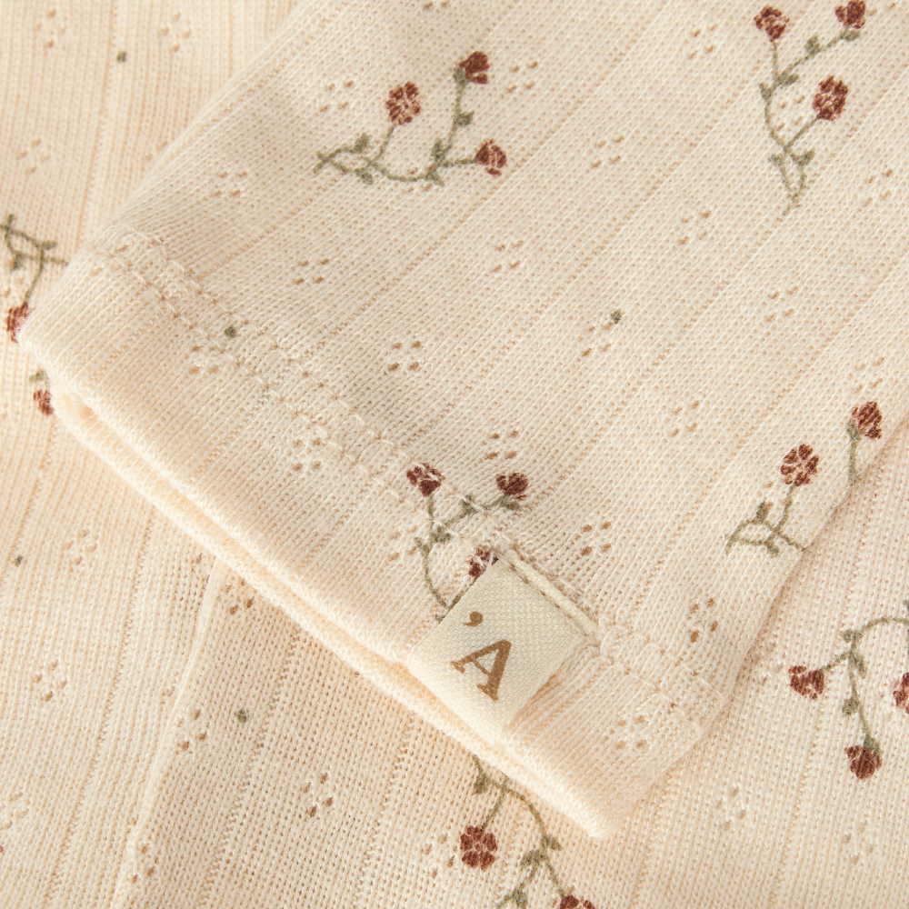 Lil’ Atelier Legginsy niemowlęce Novelle Peach Flower
