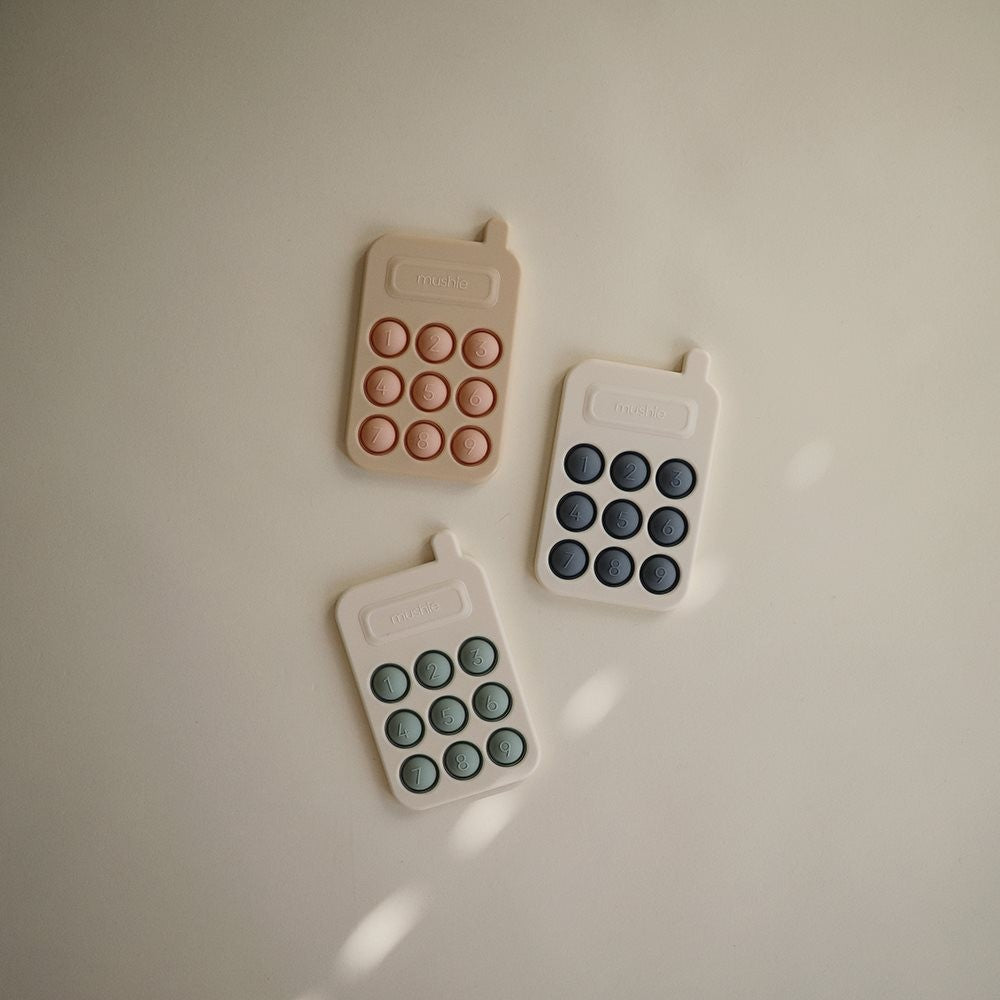 Mushie Zabawka sensoryczna Bąbelki do wciskania telefon Blush